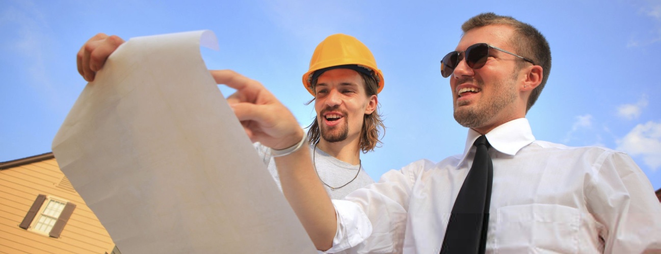 ADU Permitting in Los Angeles and Construction crew looking over blueprints.
