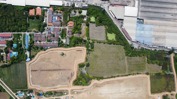 Area of large plant from top view with space of industrial and green area around.