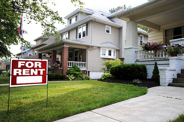 Home For Rent Sign in Front of Beautiful American Home