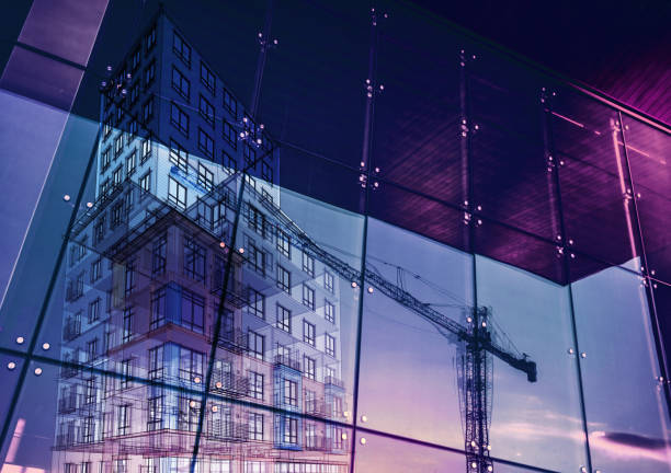 Construction crane and a new high rise building reflected into a newly built office building. New offices are being built to satisfy the growing demand (note to inspector: i am the author of the project)