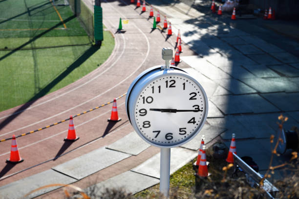 Running track visible under the clock tower. 9 O'Clock 15 minutes