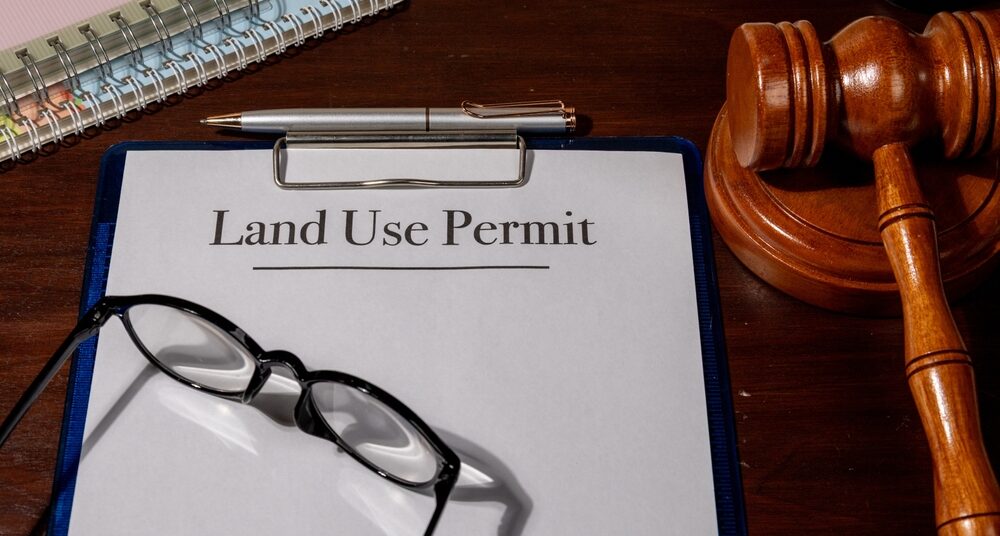 Property Law Concept Depicted with Land Use Permit Document, Gavel, and Pen Emphasizing Legal Approval for Land Development