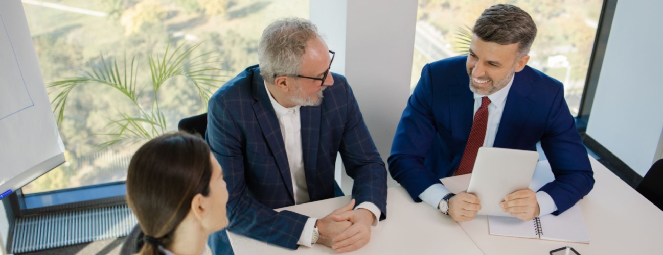 group of businessmen and investors discuss investing in real estate and jointly plan investments in construction projects of condominiums and apartments for sale and rent. investment advisory concept