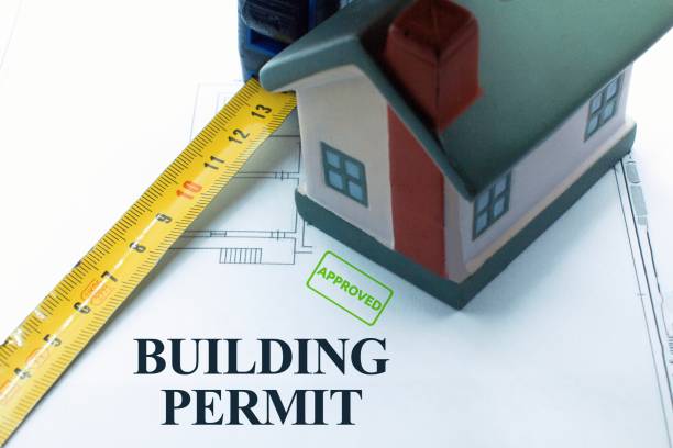 Buildings Permit concept with residential building project against an imaginary floor plans and elevations project of a new building