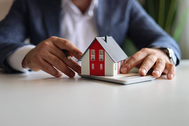 Real estate agent discuss about the terms of the home purchase agreement and asked the customer to sign the documents to make the contract legally, Home sales, lease, mortgage and home insurance.