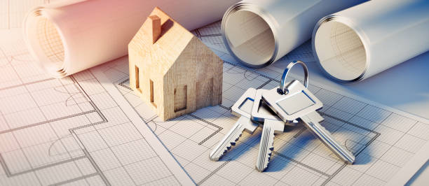 Keys with symbol house key ring, toy house and architectural plans in sunlight - 3d illustration