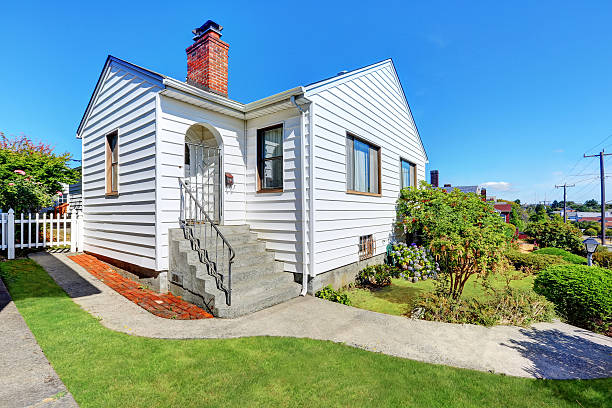 Cute small American house with white exterior paint. Northwest, USA