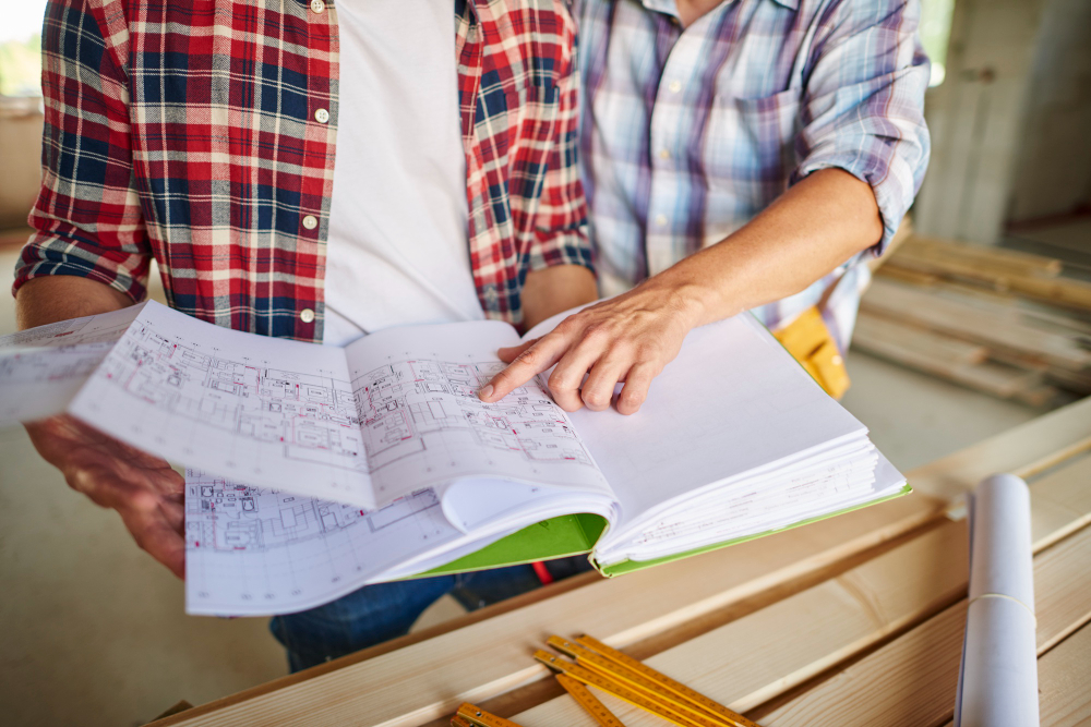 Handsome young carpenter working with an experienced man 