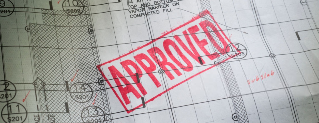 Blueprint with the word APPROVED stamped in red