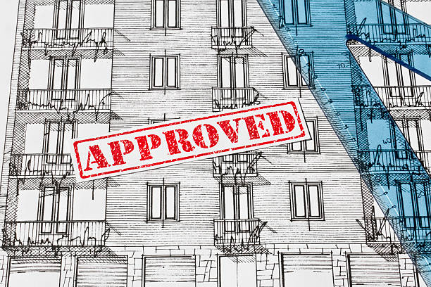 APPROVED BUILDING PERMIT DOCUMENT WITH ARCHITECTURAL BLUEPRINT of an old residential building - Concept of construction, real estate development, and planning approval
