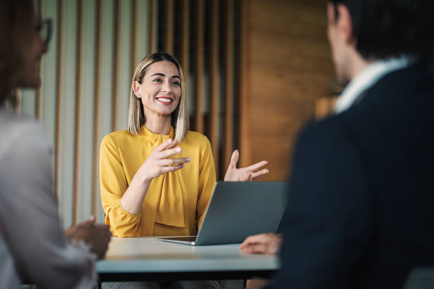 Colleges sharing ideas and important documents during a meeting in the office.