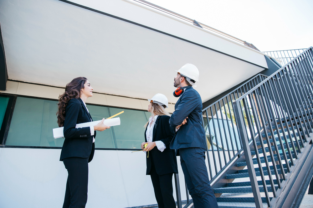 Team of architects looking at construction site