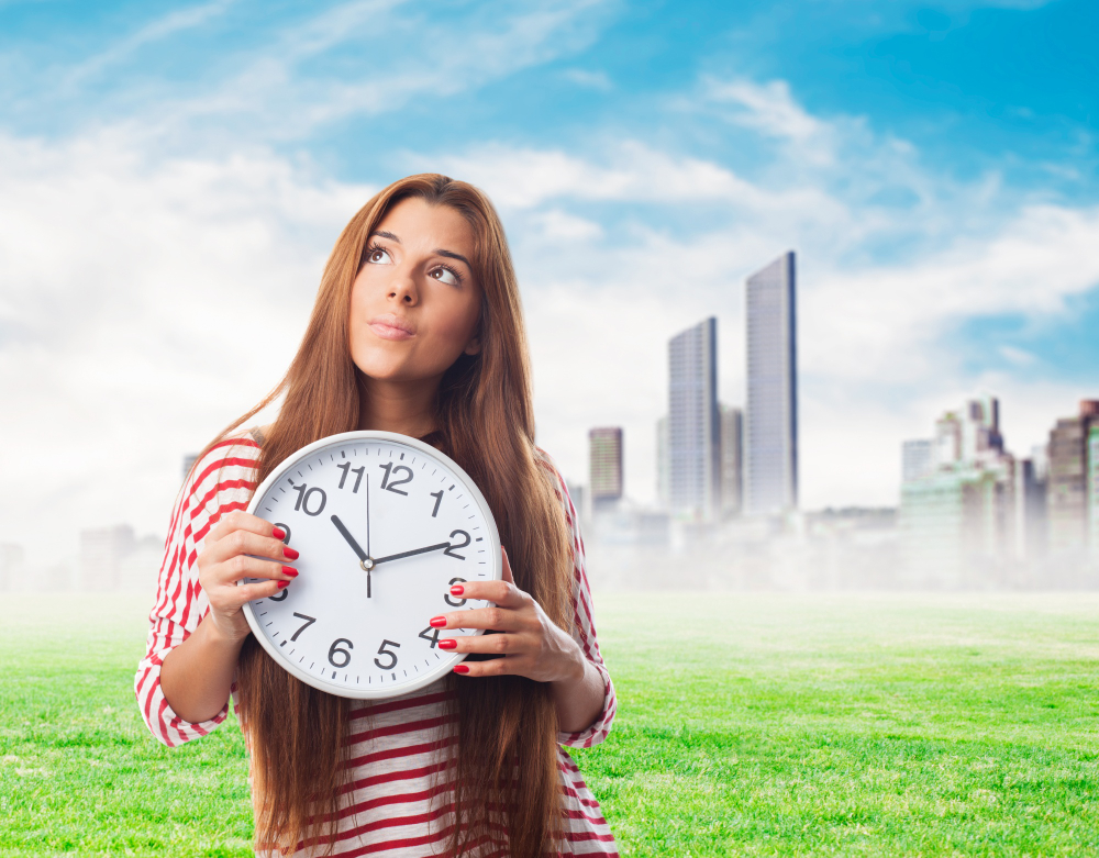 Cute girl with a clock