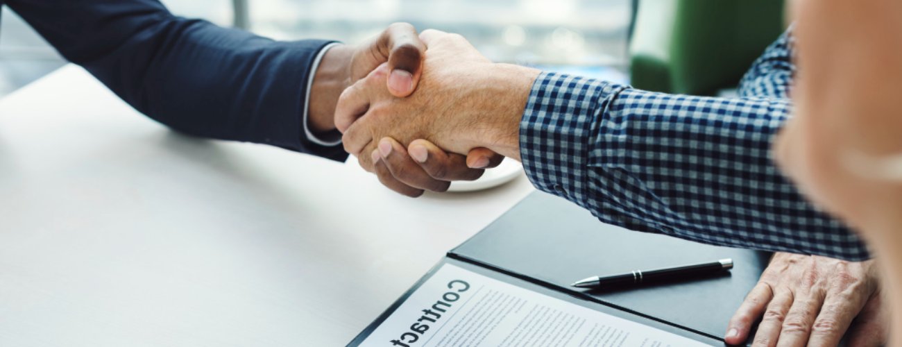 grok-image-ab52af73-db30-483b-82be-a63ed86fc5e0 Two men shaking hands