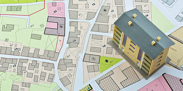 Imaginary cadastral map and general urban plan with cadastral parcels, urban destinations, vacant land plots and condominium residential building