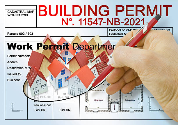BUILDINGS PERMIT CONCEPT with residential building project and group of home residential building models - Real estate concept
