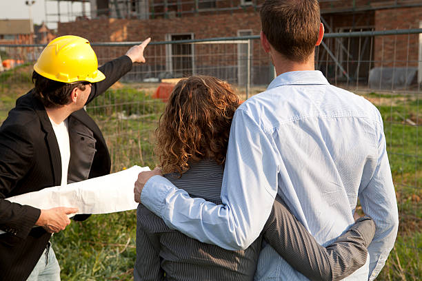Buyers checking the new plans.If you want more images with a happy couple please click here.