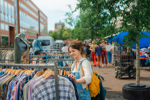 Woman shopping in pop-up thrift shop in Amsterdam on weekend