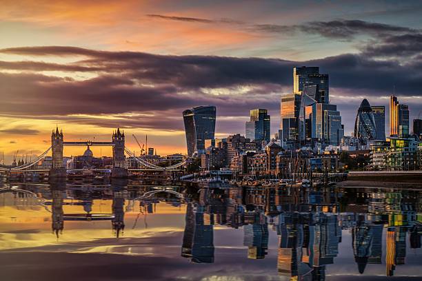 Beautiful autumn sunset view of the skyline of London, England, with reflections in the River Thames