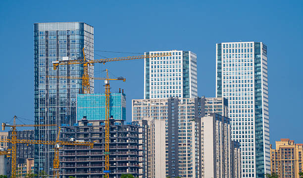 building construction site with construction frame and crane