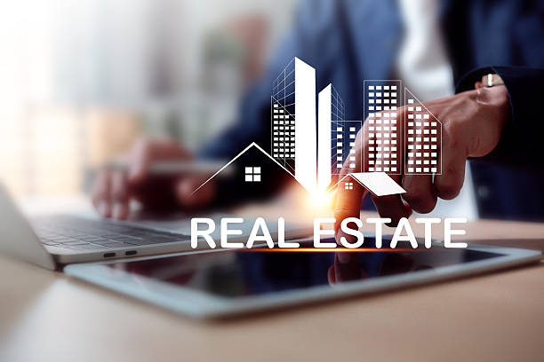 Businessman Using Tablet for Smart Home Technology and Real Estate Data Analysis.