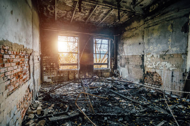 Burned interiors of industrial hall after fire in the factory.