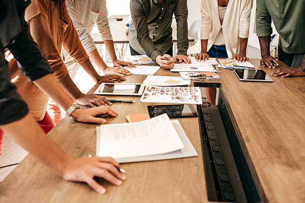 Hands over the table as a business concept