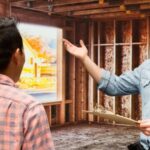 Smiling building contractor presenting