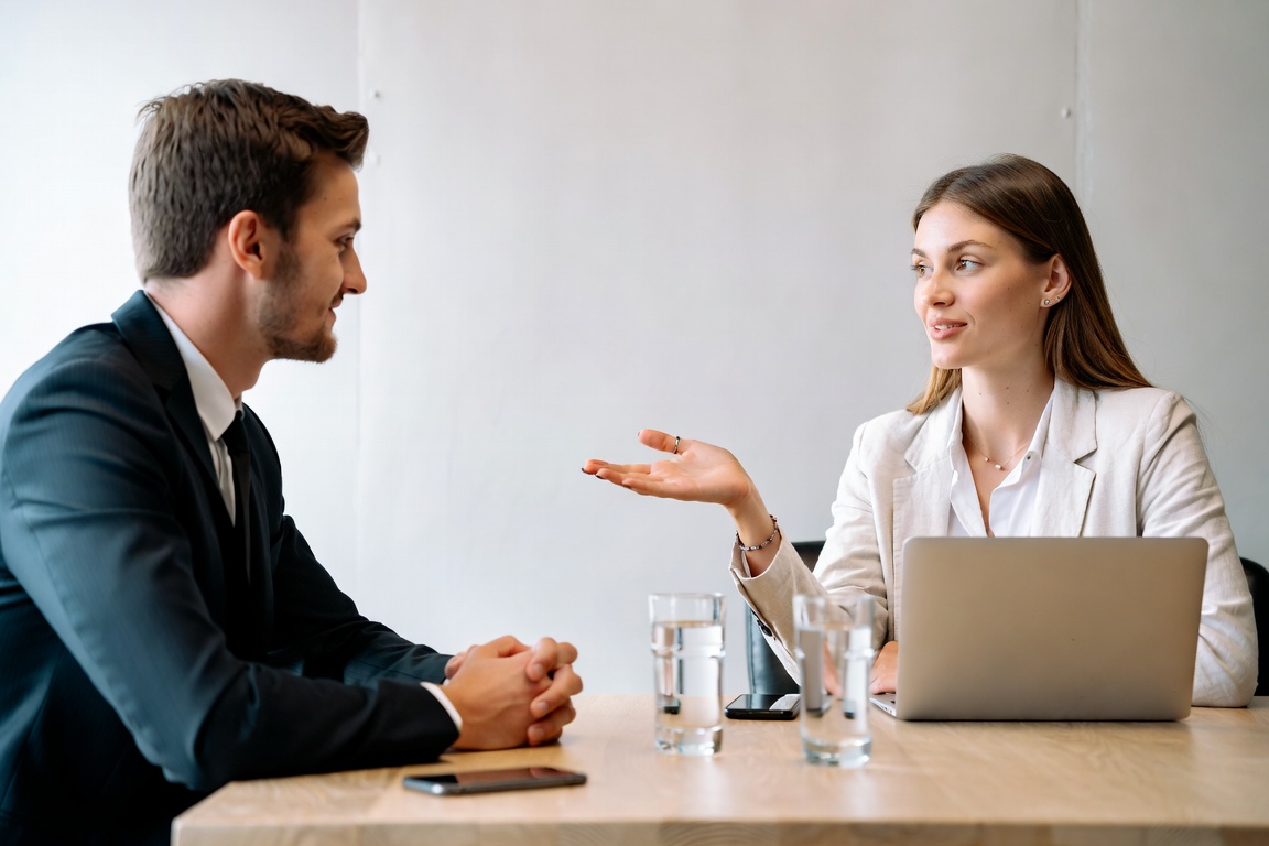 Business professionals discussing project details in consultation meeting, partner with JDJ Consulting land development experts in California, Texas and Florida